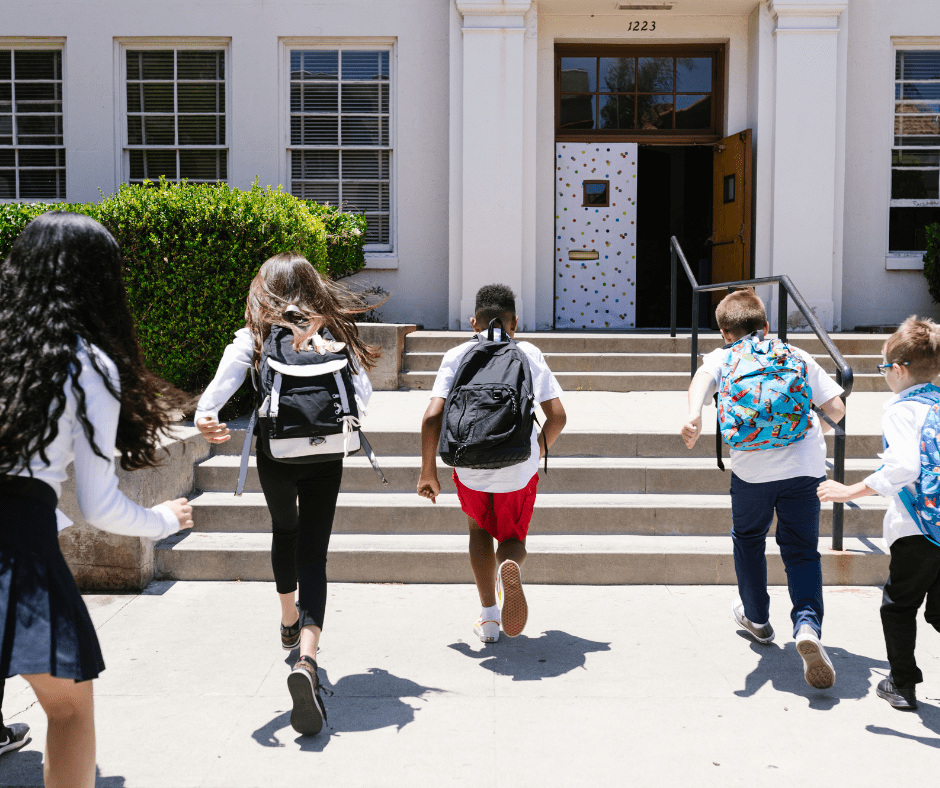 kids in backpacks returning to school