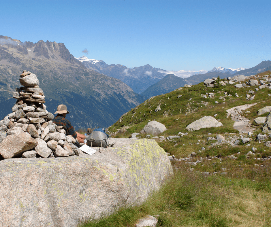 Hiker relaxing by mountains, Alps, France